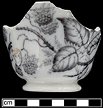 Handled cup  printed in flown mulberry with a floral motif. Impressed “M” or “W” on base - Collected by George L. Miller in 1986 in Hanley.  Cannot be attributed to a specific pottery. 